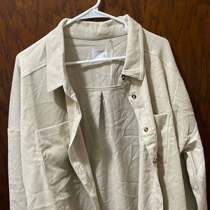 Cream colored, corduroy material.